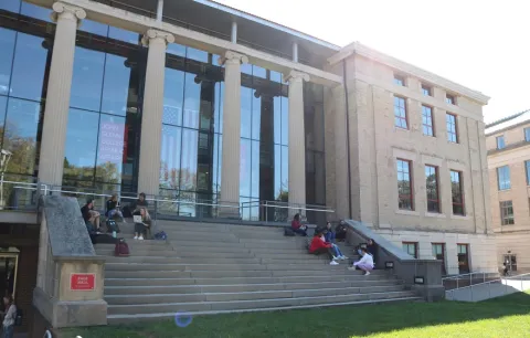 Glenn College master of public administration students study on steps of page hall at ohio state