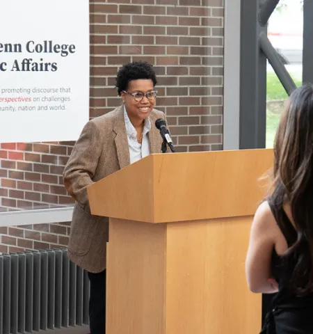 Chanel Cornett, Senior Counsel, Trust and Safety, Zoom Video Communications Inc. and 2015 NEW Leadership Participant, at a podium speaking.