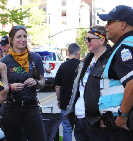 Two Columbus Dialogue Team police officers talk to participants at this summer's Pride March downtown.