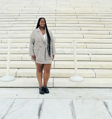 John Glenn College of Public Affairs student Maceda Berhanu poses for a photo on the steps of the U.S. Supreme Court in Washington, D.C. 