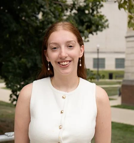 Taylor Lefkowitz, an undergraduate student at the John Glenn College of Public Affairs, stands outside in front of Ohio State’s Page Hall.